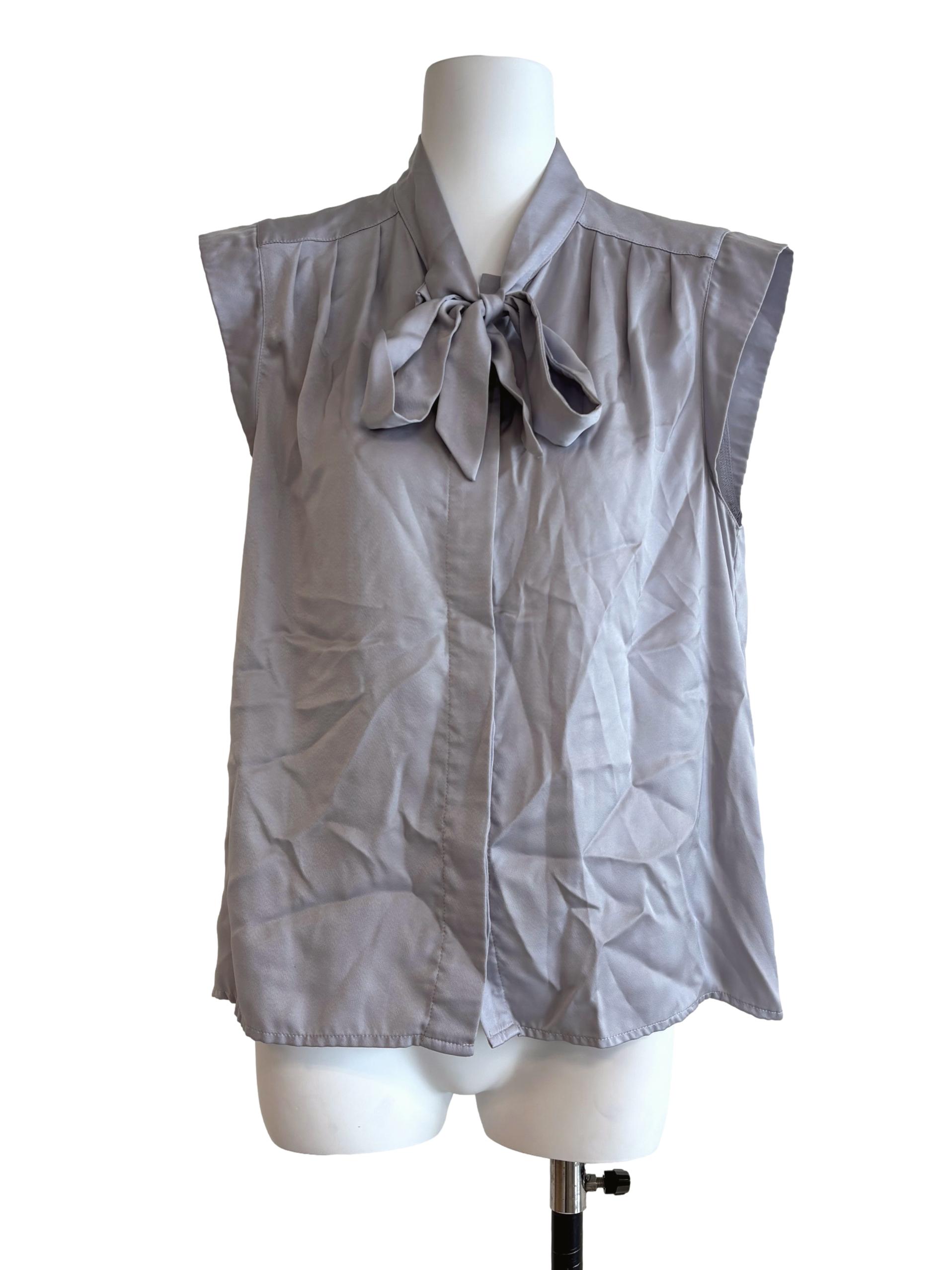 Silver Sleeveless Buttoned Top