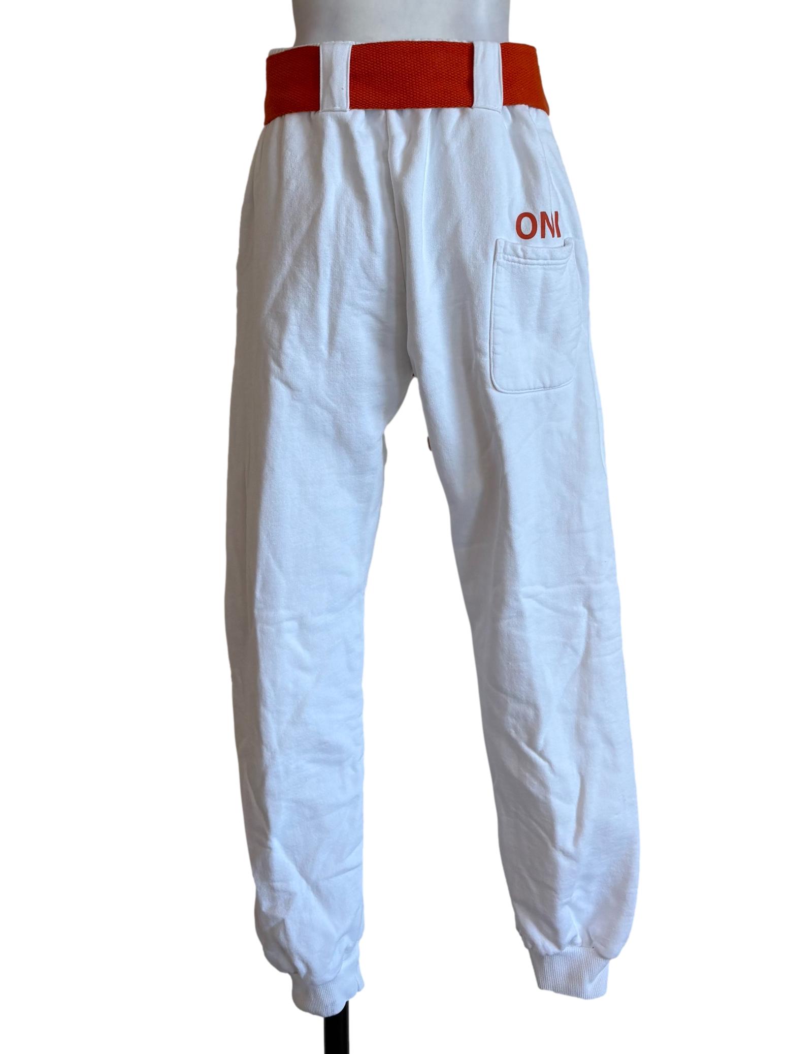 White Sweatpants With Orange Belt