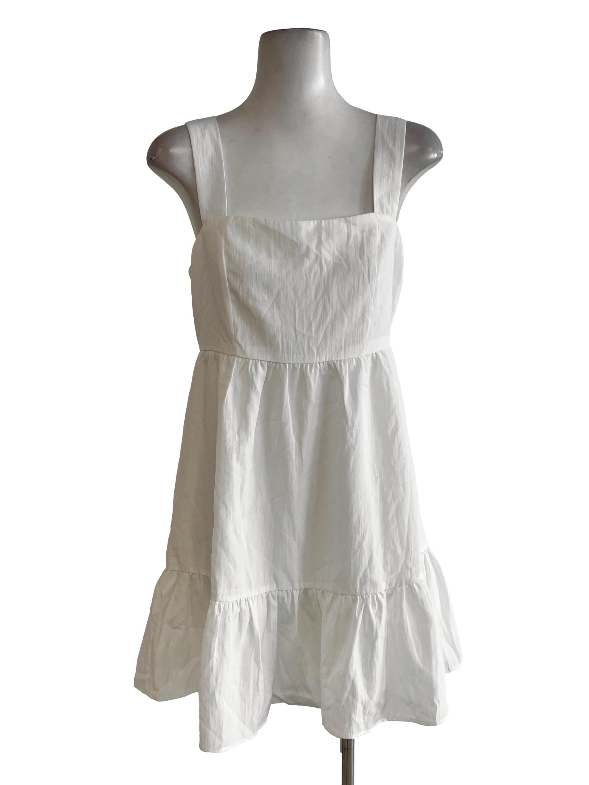 White Apron Dress With Puffy Skirt On The Bottom Of Dress