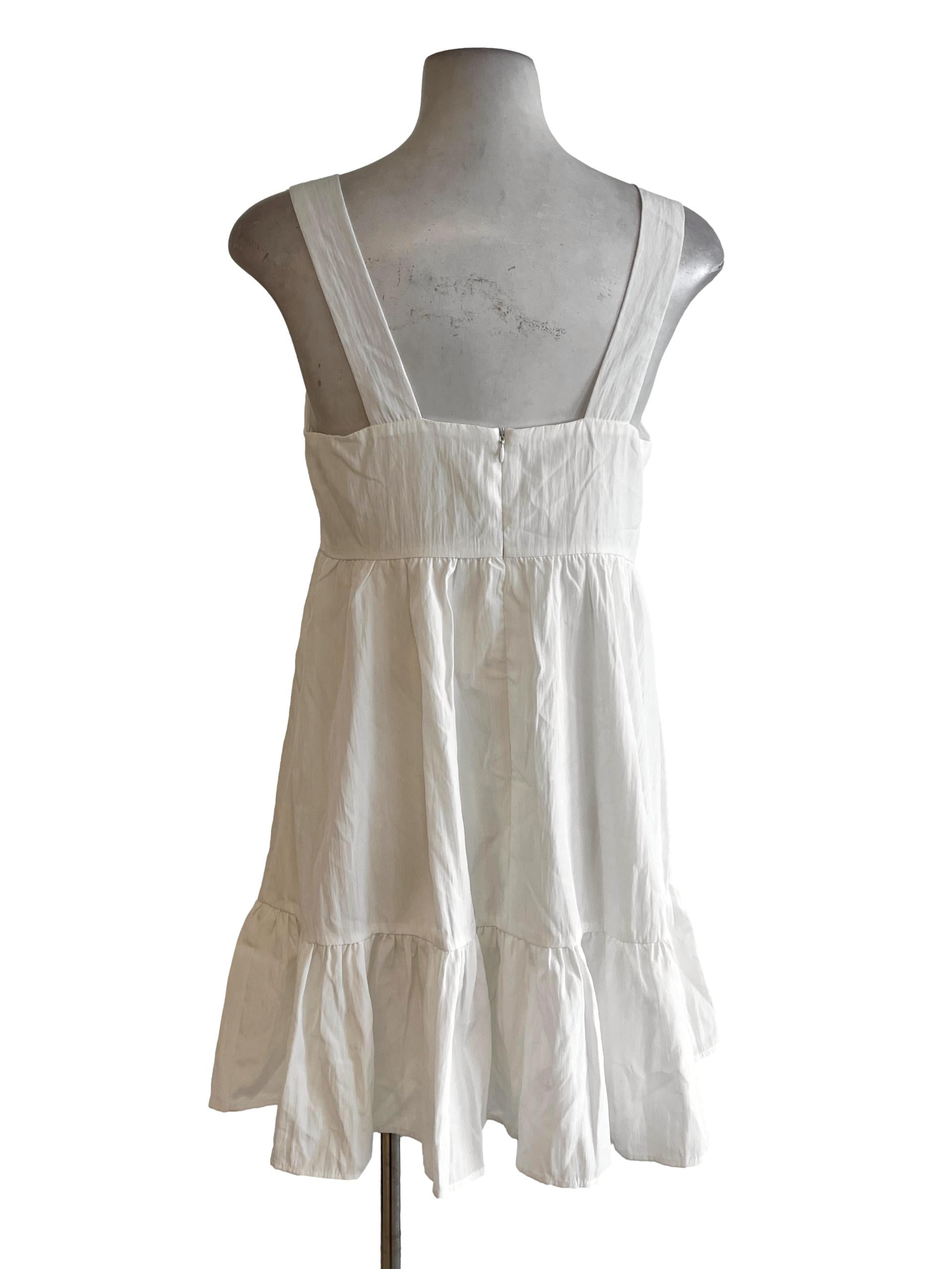 White Apron Dress With Puffy Skirt On The Bottom Of Dress