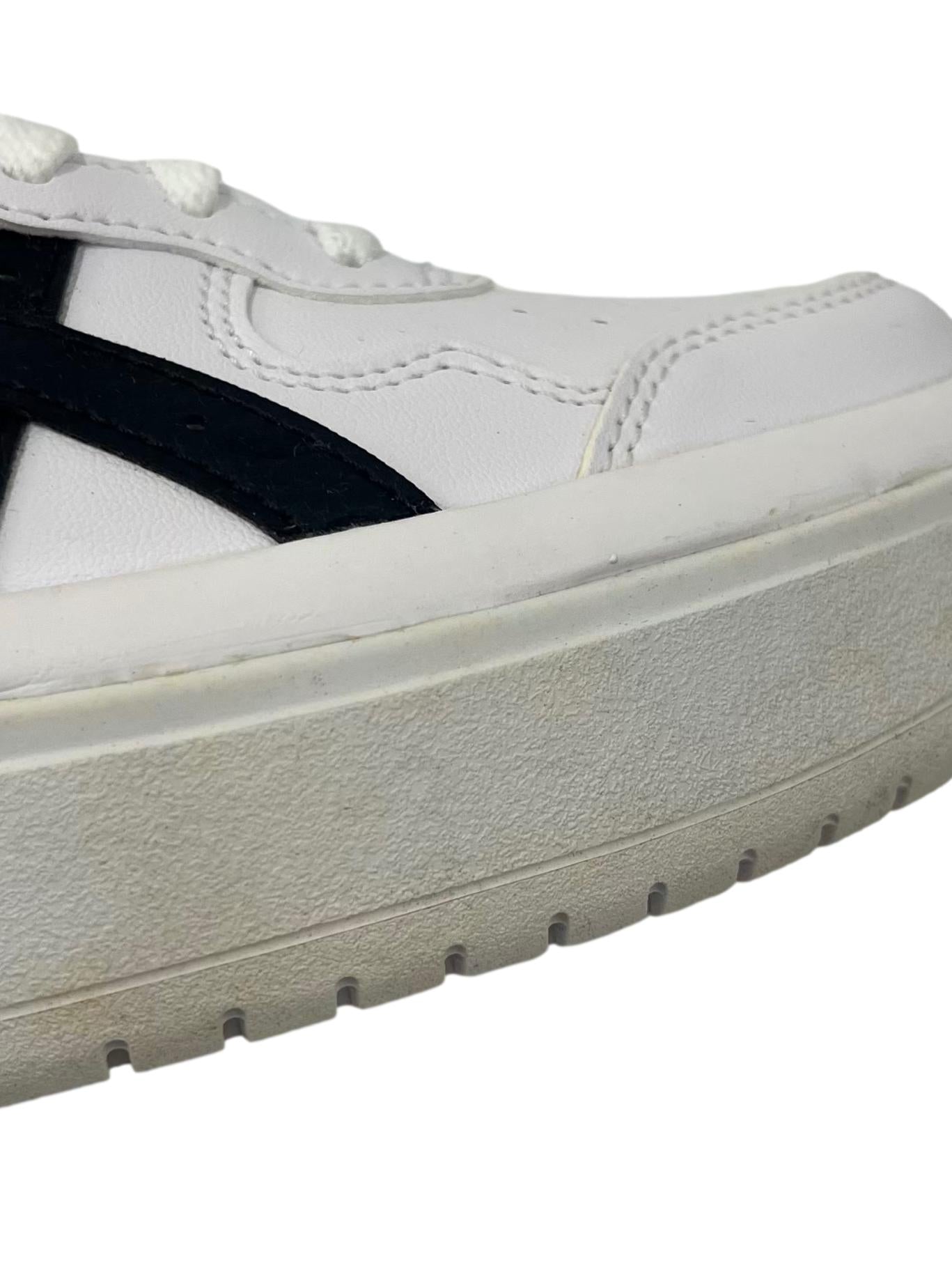 White Sneakers With Black Details